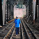 Boy on railroad tracks
