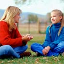 Woman sitting with girl
