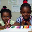 Two girls with markers